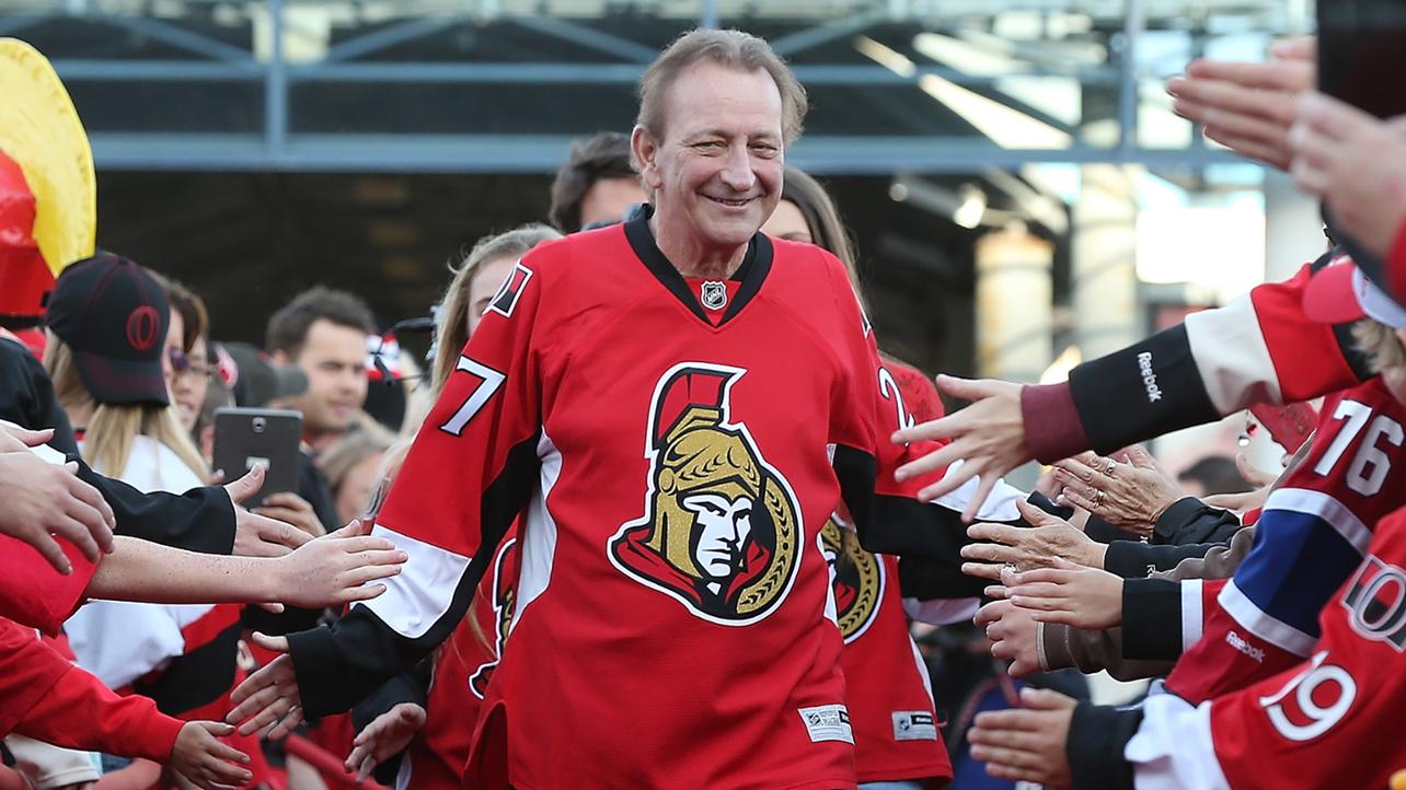 famous sports man walking through crowd