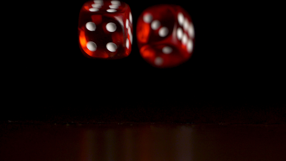 Two red dice suspended