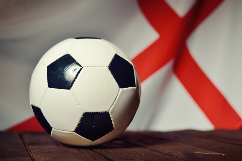 flag of England with soccer ball on wooden boards