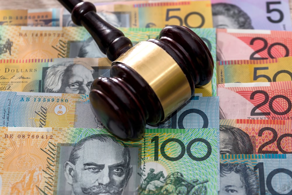 A gavel on Australian dollars